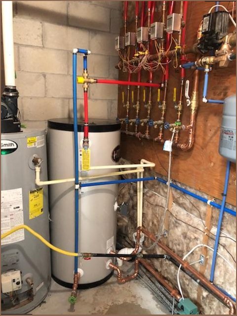 Water heater installation with color-coded PEX piping